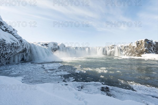 Gooafoss Waterfall in winter with snow and ice