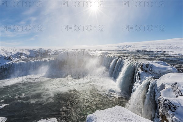 Gooafoss Waterfall in winter with snow and ice