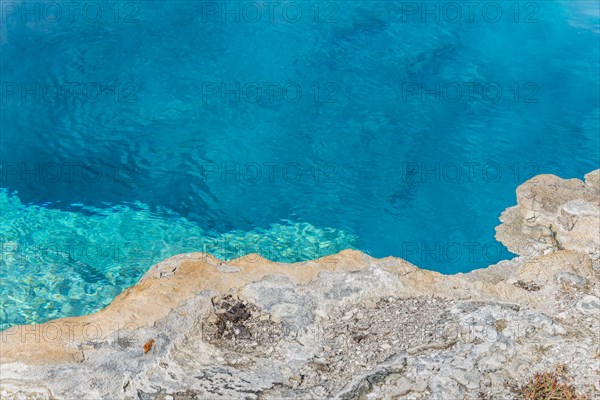 Turquoise clear water of a hot spring