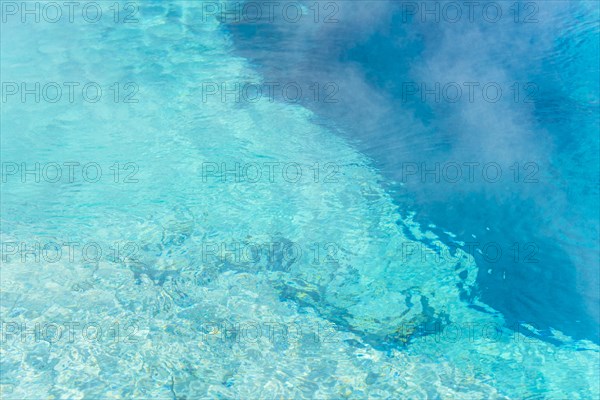 Turquoise clear water of a hot spring