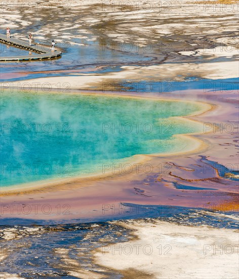 Colored mineral deposits at the edge sr steaming hot spring