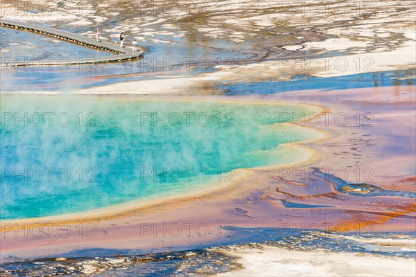 Colored mineral deposits at the edge sr steaming hot spring