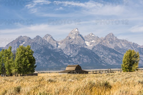 Historic old barn in front of the Teton Range mountain range