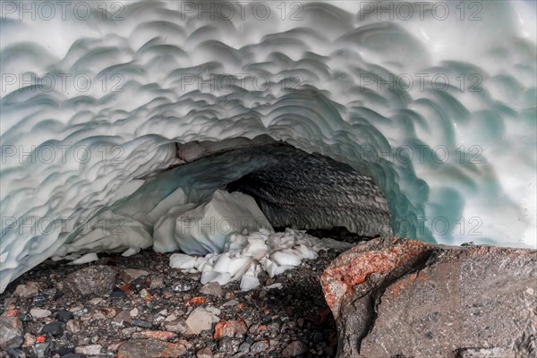 Entrance of an ice cave of a glacier