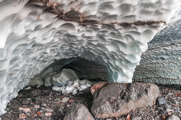 Entrance of an ice cave of a glacier