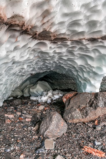 Entrance of an ice cave of a glacier