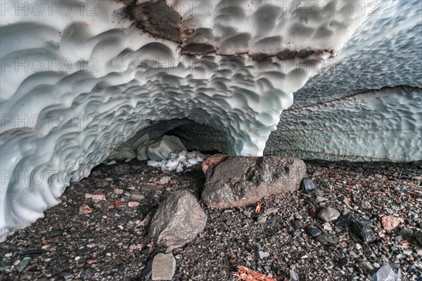 Entrance of an ice cave of a glacier