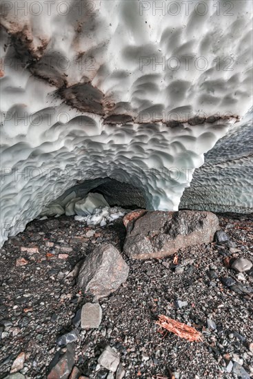 Entrance of an ice cave of a glacier