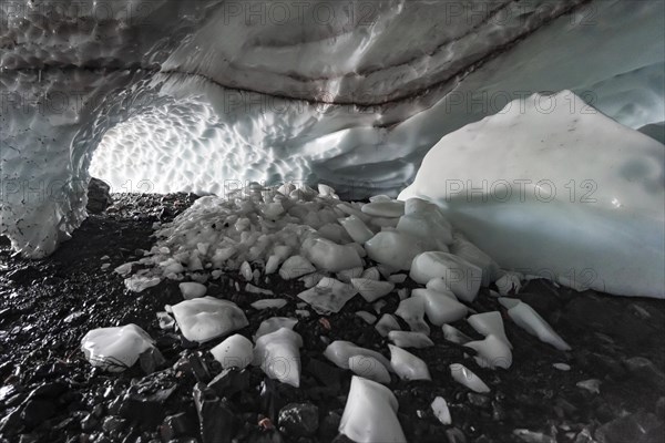 Entrance of an ice cave of a glacier