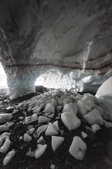 Entrance of an ice cave of a glacier