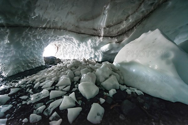 Entrance of an ice cave of a glacier