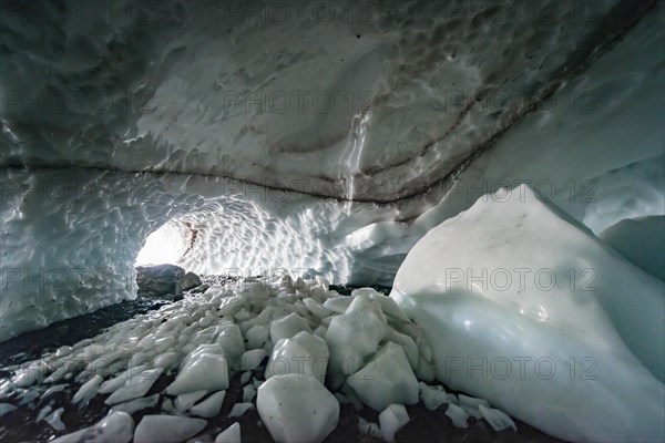 Entrance of an ice cave of a glacier