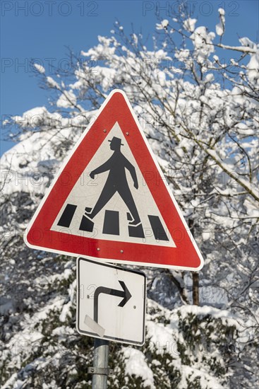 Pedestrian sign on a zebra crossing