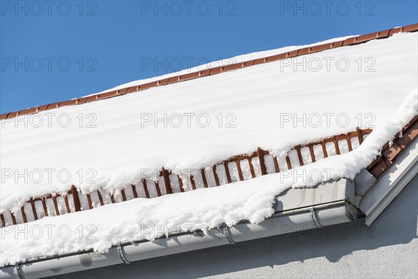 Snow guard on the roof with snow