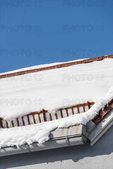 Snow guard on the roof with snow