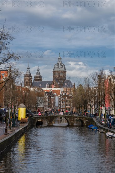 View from a bridge at Oudezijds Voorburgwal to the canal and the Sint Nicolaaskerk