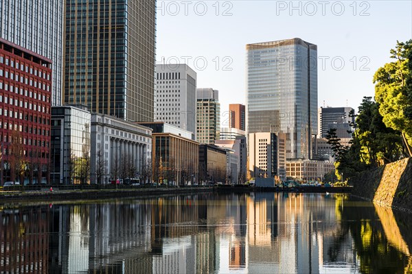 High-rise buildings reflected in a canal