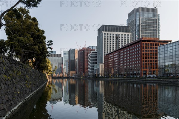 High-rise buildings reflected in a canal