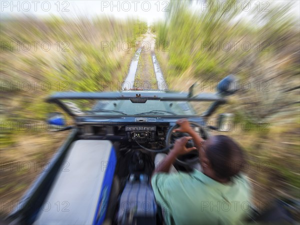 Fast ride in an open-top Jeep