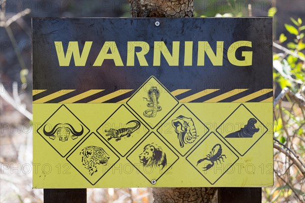 Warning sign displaying dangerous animals