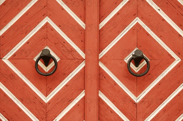 Historic door knockers at the old town hall gate