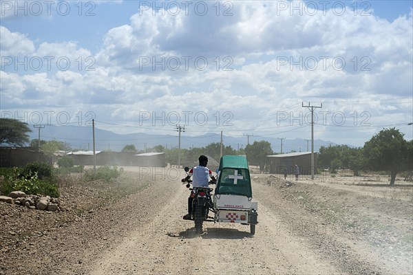 Emergency doctor on motorcycle with sidecar