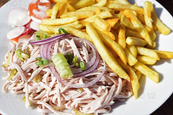 Sausage salad with French fries