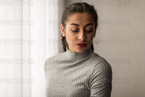 Portrait of a young woman with pigtails