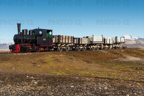 Historic mine train in front of the Kongsfjorden