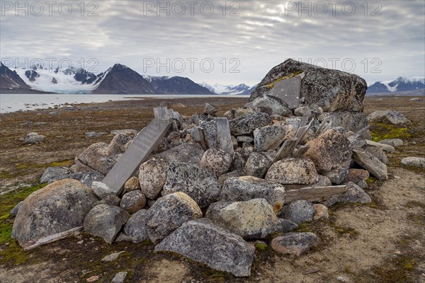 Remains of wooden coffins and gravestones