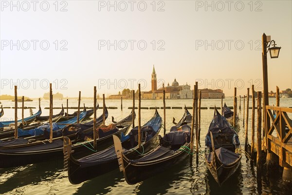 Gondolas in San Marco and Benedictine church of San Giorgio Maggiore on San Giorgio Maggiore island