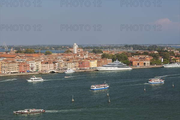 City view with excursion boats and vaporetto in the lagune