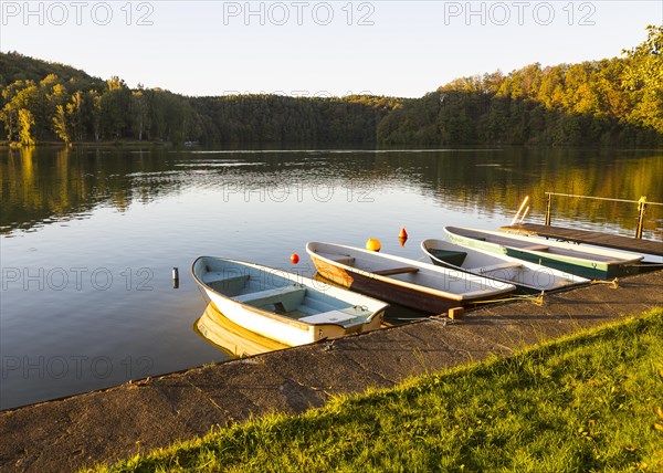Boats lie on the shore in the evening sun