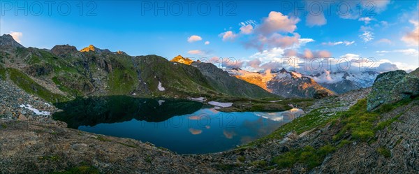 Lake Schwarzsee in the evening light with mountain range