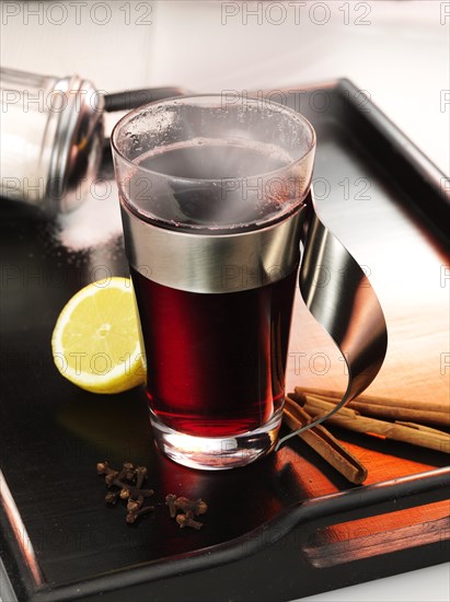 Hot mulled wine on dark tray