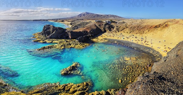 Sandy beach Playa del Papagayo with clear turquoise water