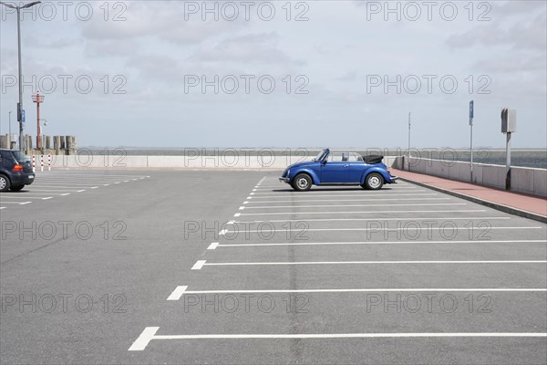 Blue Beetle cabriolet stands at the port of Wyk on Fohr