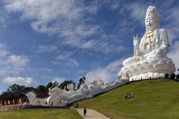 Giant Guan Yin statue sits on lotus flower