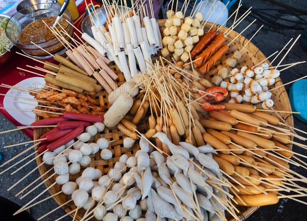 Various skewers with sausage and meat