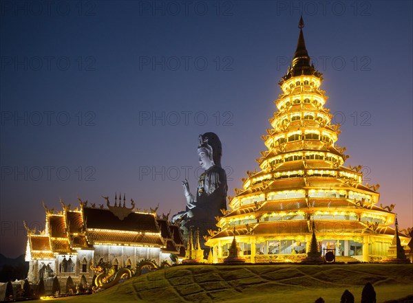 Illuminated Wat Huay Pla Kang Temple at dusk