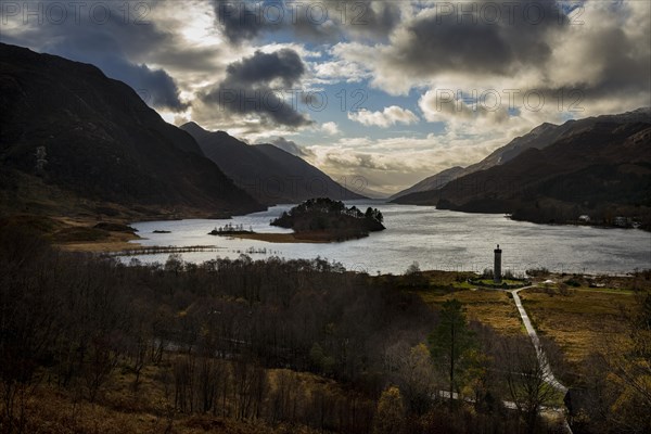 Loch Shiel with Glenfinnan Monument under cloudy sky