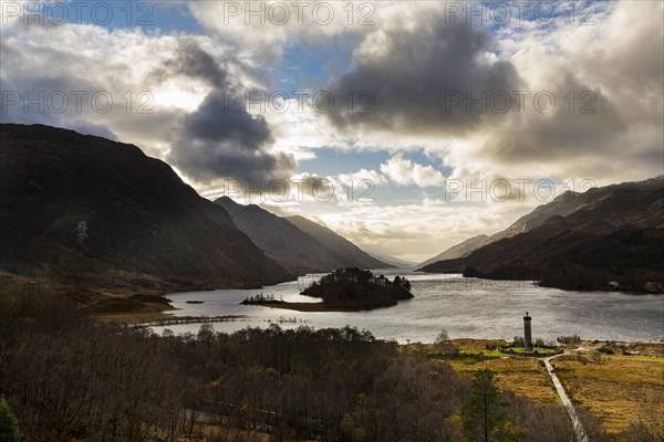 Loch Shiel with Glenfinnan Monument under cloudy sky