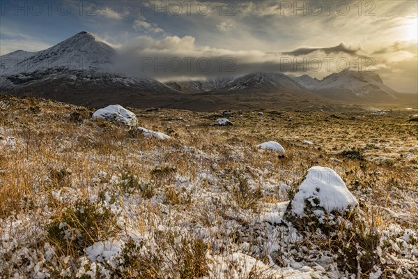 Snowy mountain tops of Ben Lee with clouds in Highland landscape