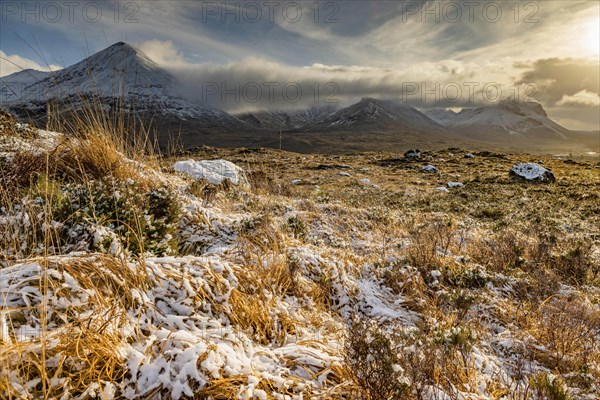 Snowy mountain tops of Ben Lee with clouds in Highland landscape