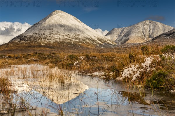 Moor landscape with snow-covered peaks of the Cullins Mountains in Highland Landscape