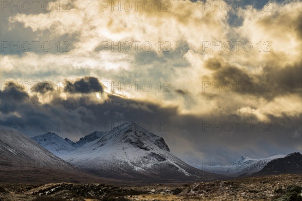 Snowy mountain tops of Ben Lee with clouds in Highland landscape