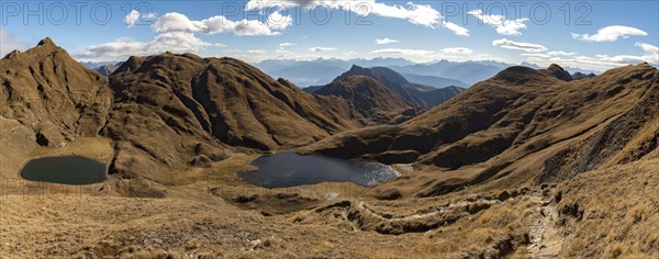 Small and medium Seefeldsee lake with autumnal mountains in the background