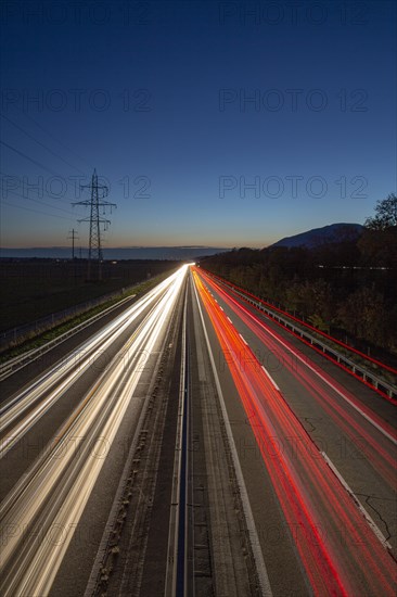 Road with light tracks at dusk