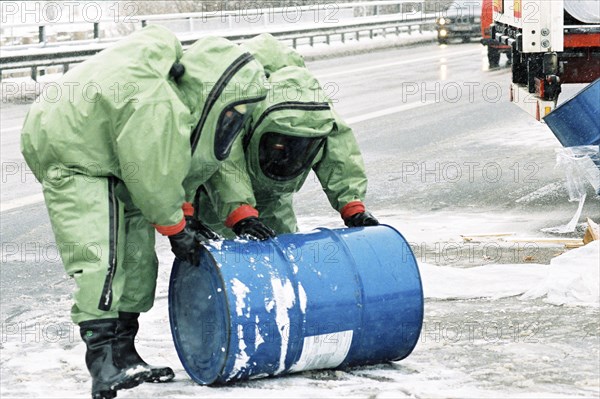 Firefighters wearing chemical protection suits