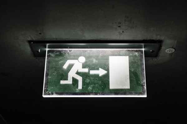 Illuminated emergency exit sign